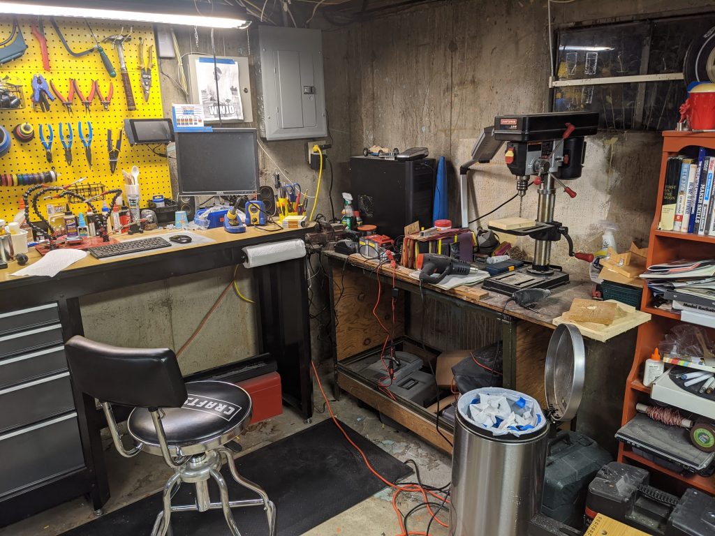 Workshop with old, sad, cluttered workbench